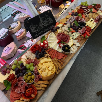 Signature Grazing Board - Our most popular table-ready graze: a full-size board overflowing with artisan cheeses, meats, fruits, olives, crackers, and seasonal garnishes. Ideal for 6–8 people.